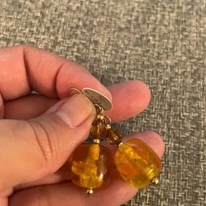 Gold tone amber plastic and glass earrings
